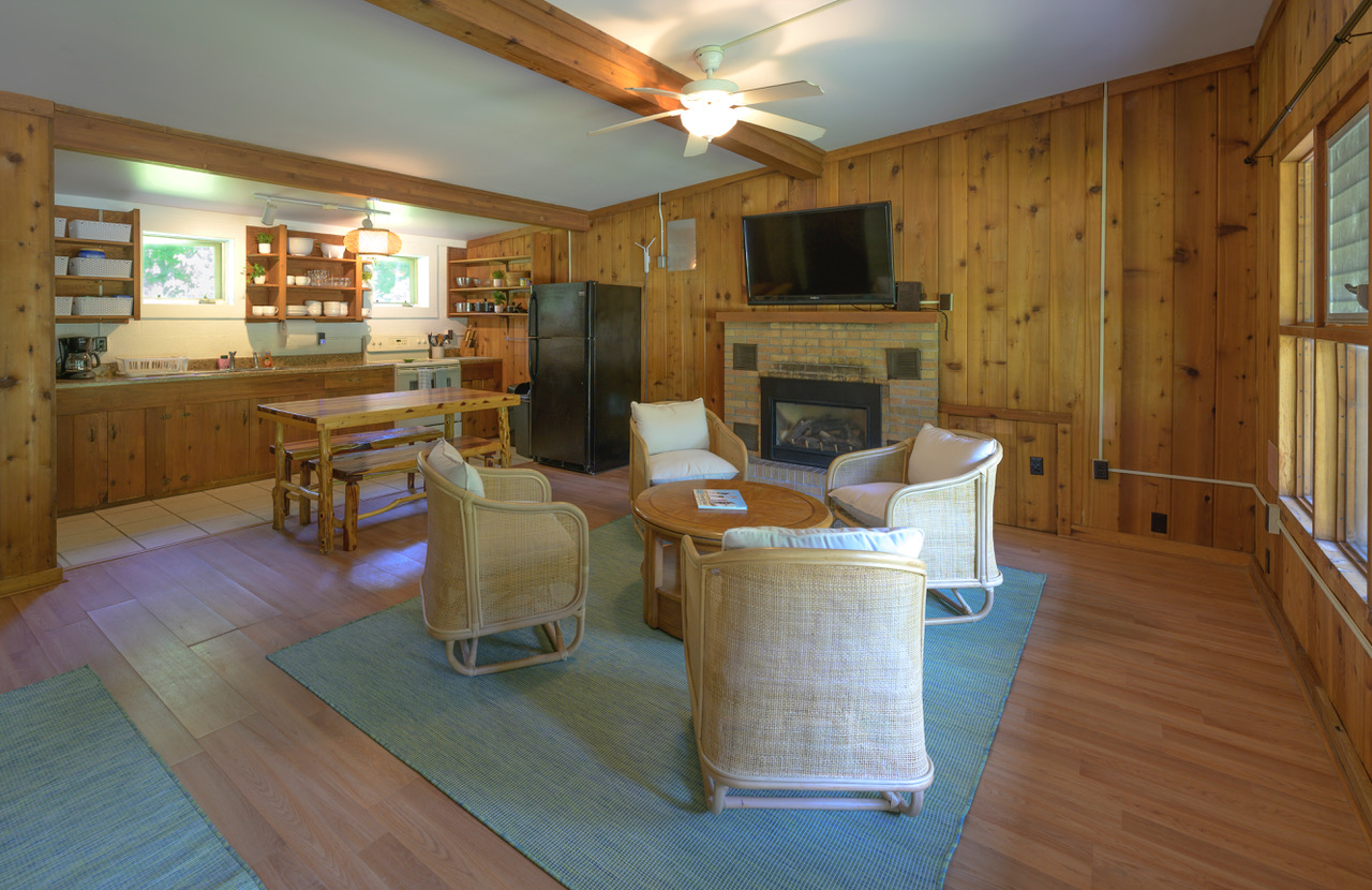 sitting area, fireplace and kitchen at dune climb inn